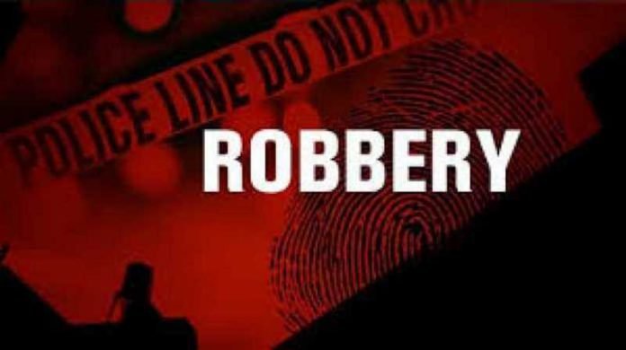 VIDEO: Gun battle between police, armed robbers in broad daylight bank heist at Spintex