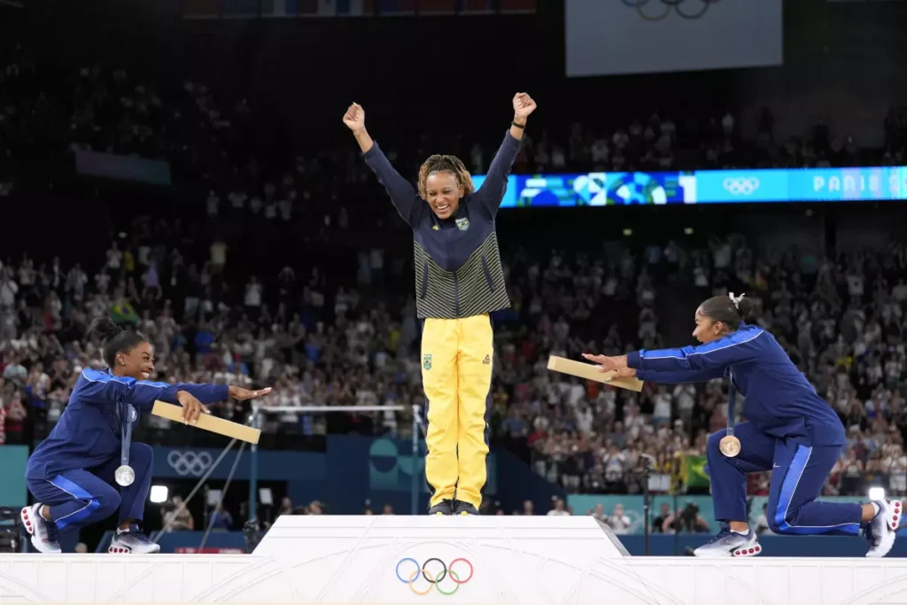 Simone Biles responds to critics after bowing to champion Rebeca Andrade